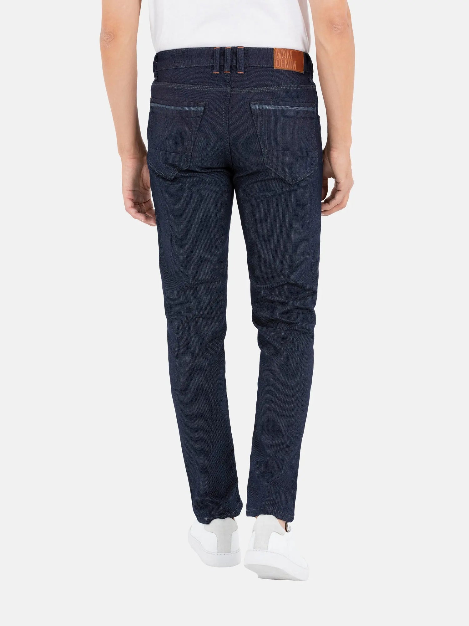 Back view of men’s slim-fit dark blue jeans with stitched pockets – Wam Denim.