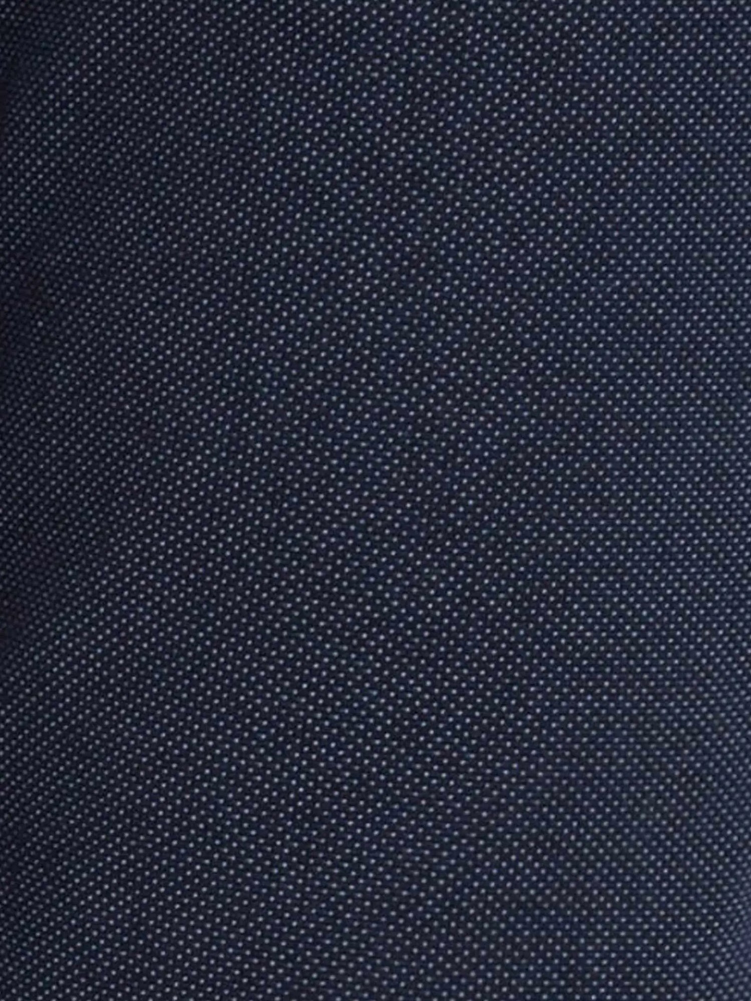 Close-up of dark blue denim fabric showing fine dotted texture and weave – Wam Denim.