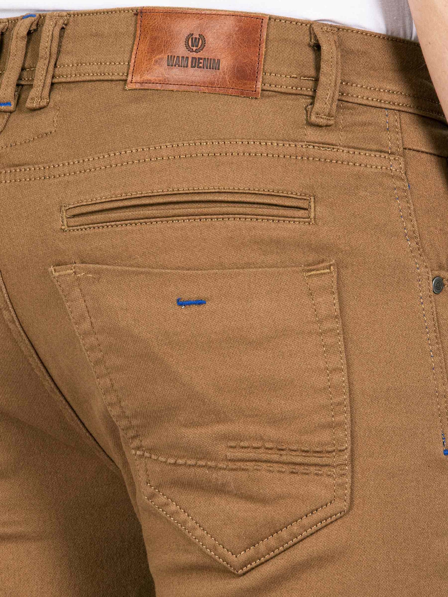 Close-up of camel brown jeans back pocket with stitching and leather Wam Denim patch – Wam Denim.