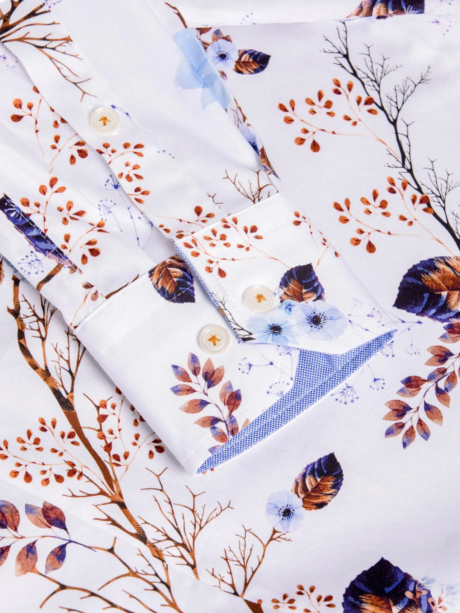 Floral and leaf patterned fabric with a white background