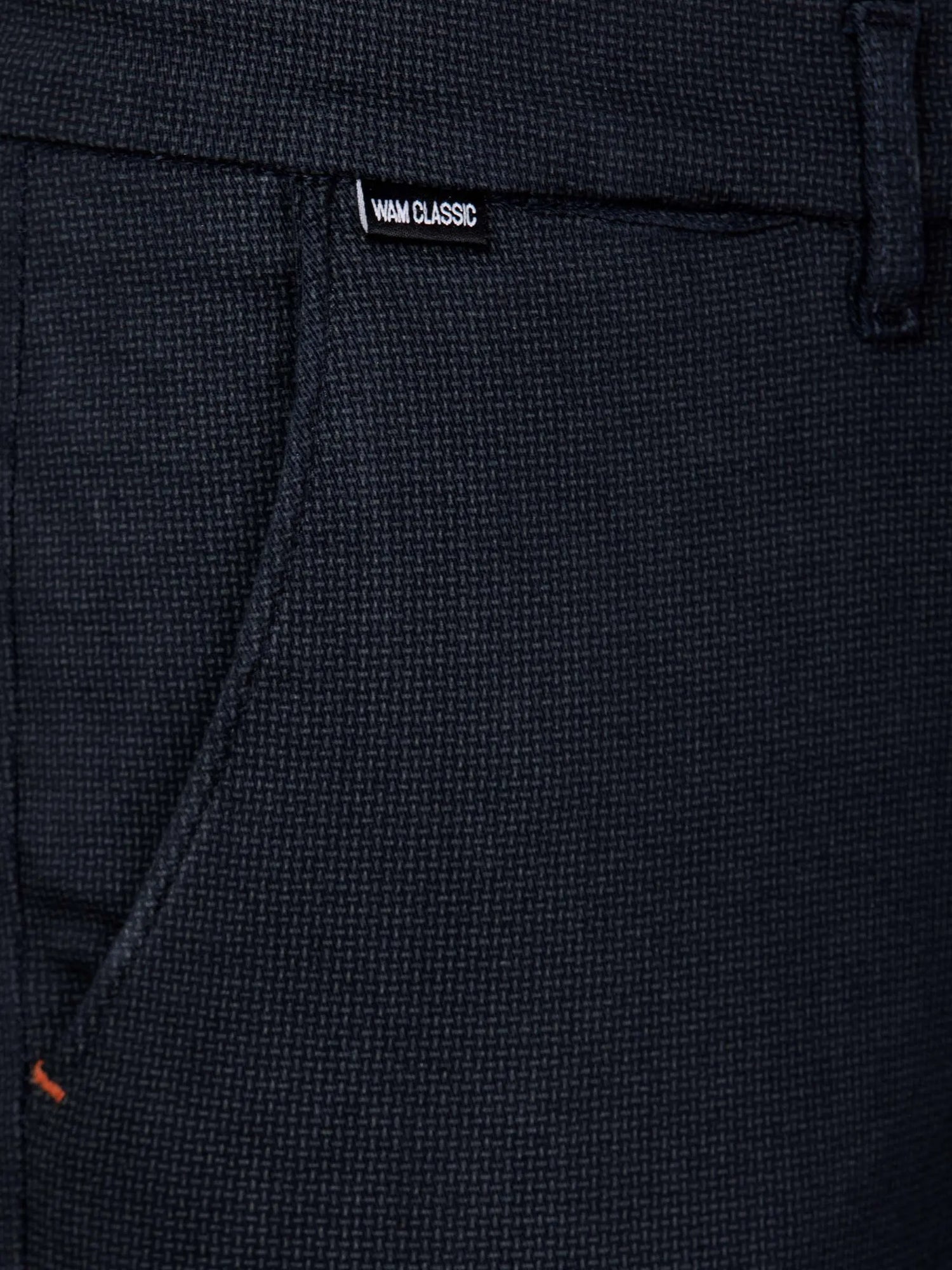 Front pocket detail of navy textured chinos with Wam Classic label – Wam Denim.