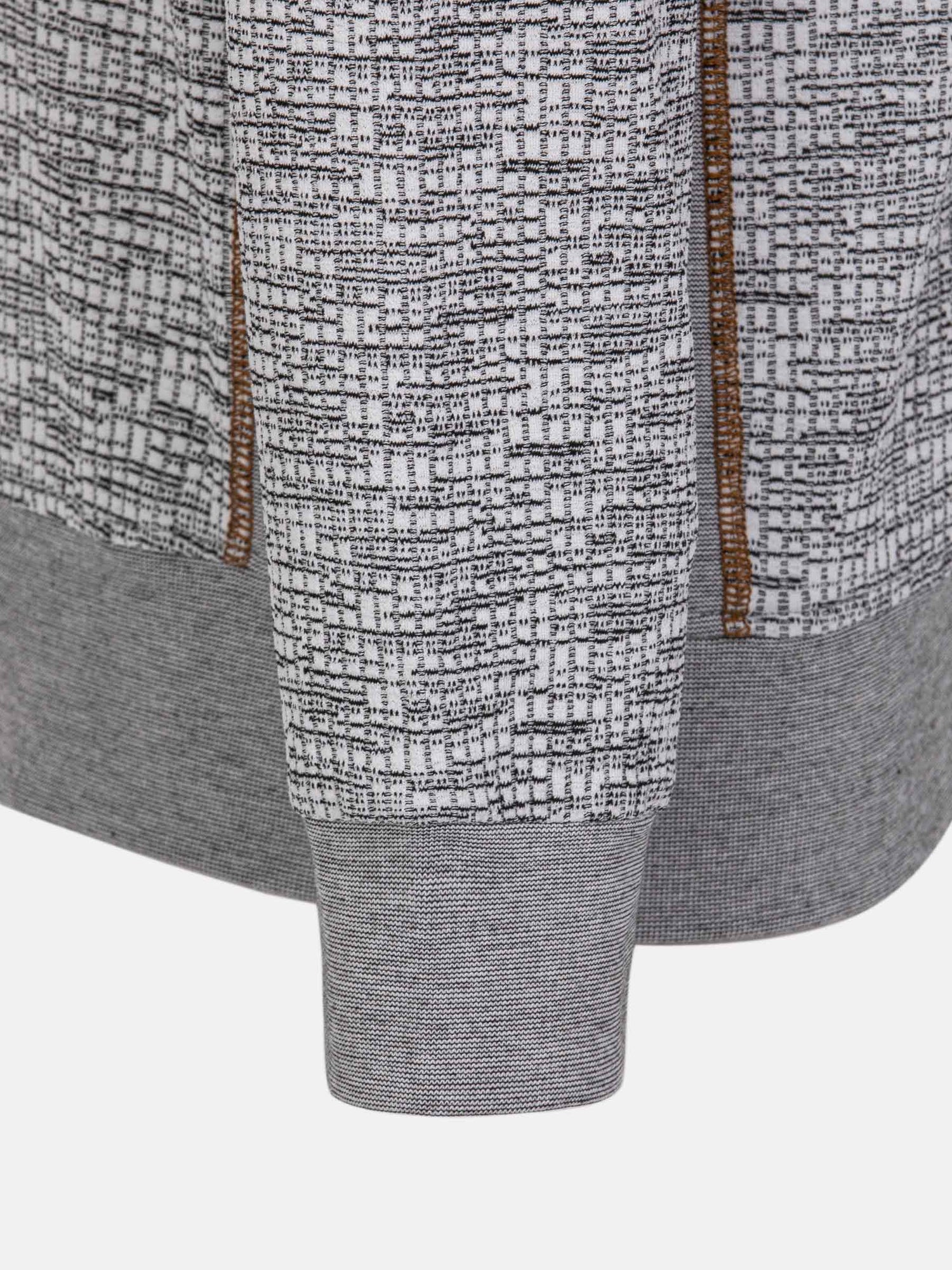 Close-up of the ribbed cuff and textured grey knit on the sweater – Wam Denim.
