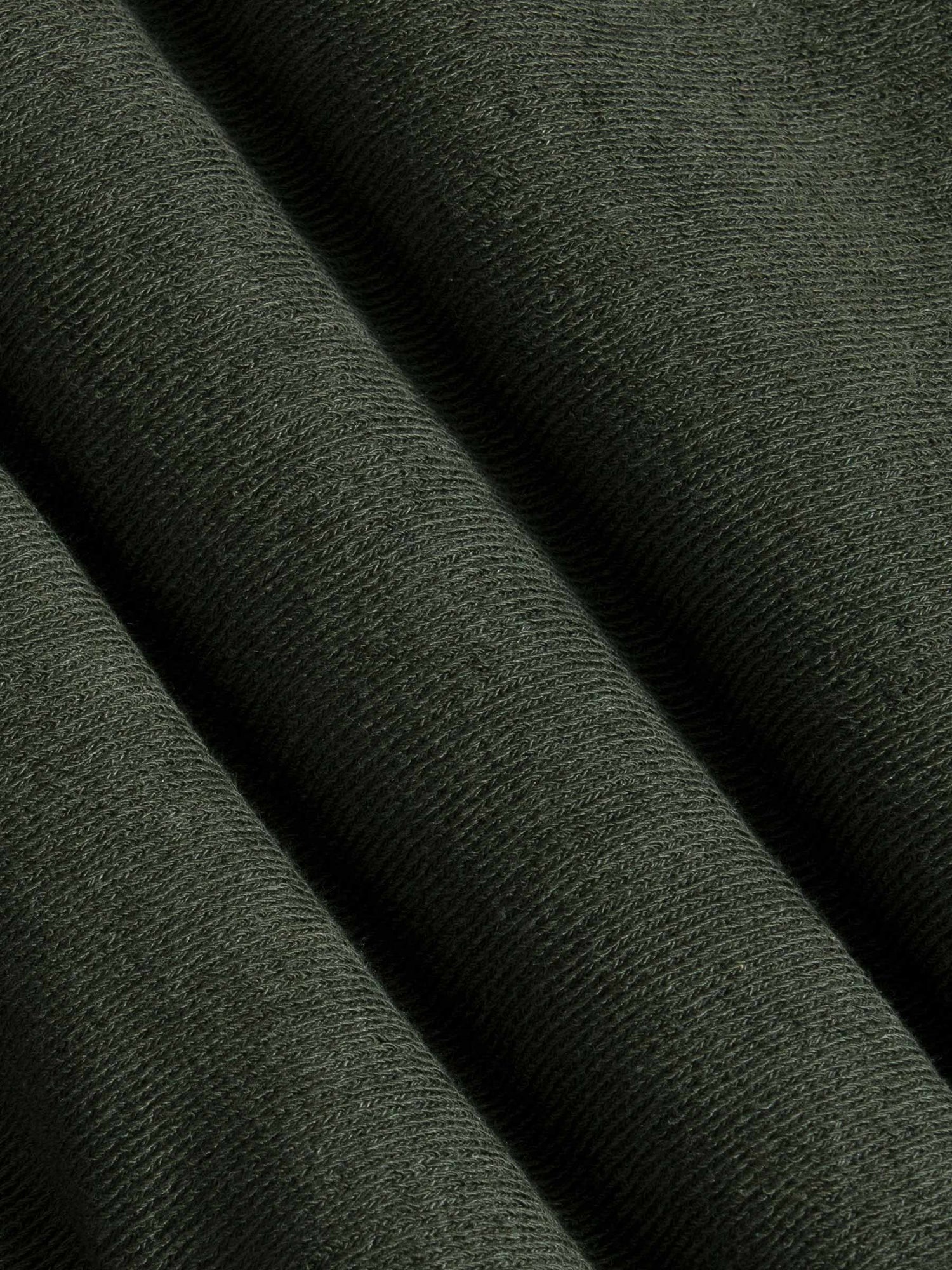Close-up of dark Khaki fabric with a textured pattern