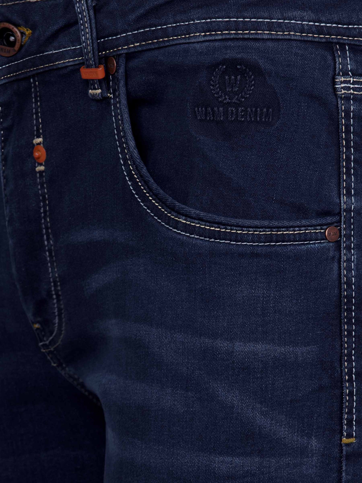 Close-up of dark navy denim jeans front pocket with embossed Wam Denim logo and stitching – Wam Denim.