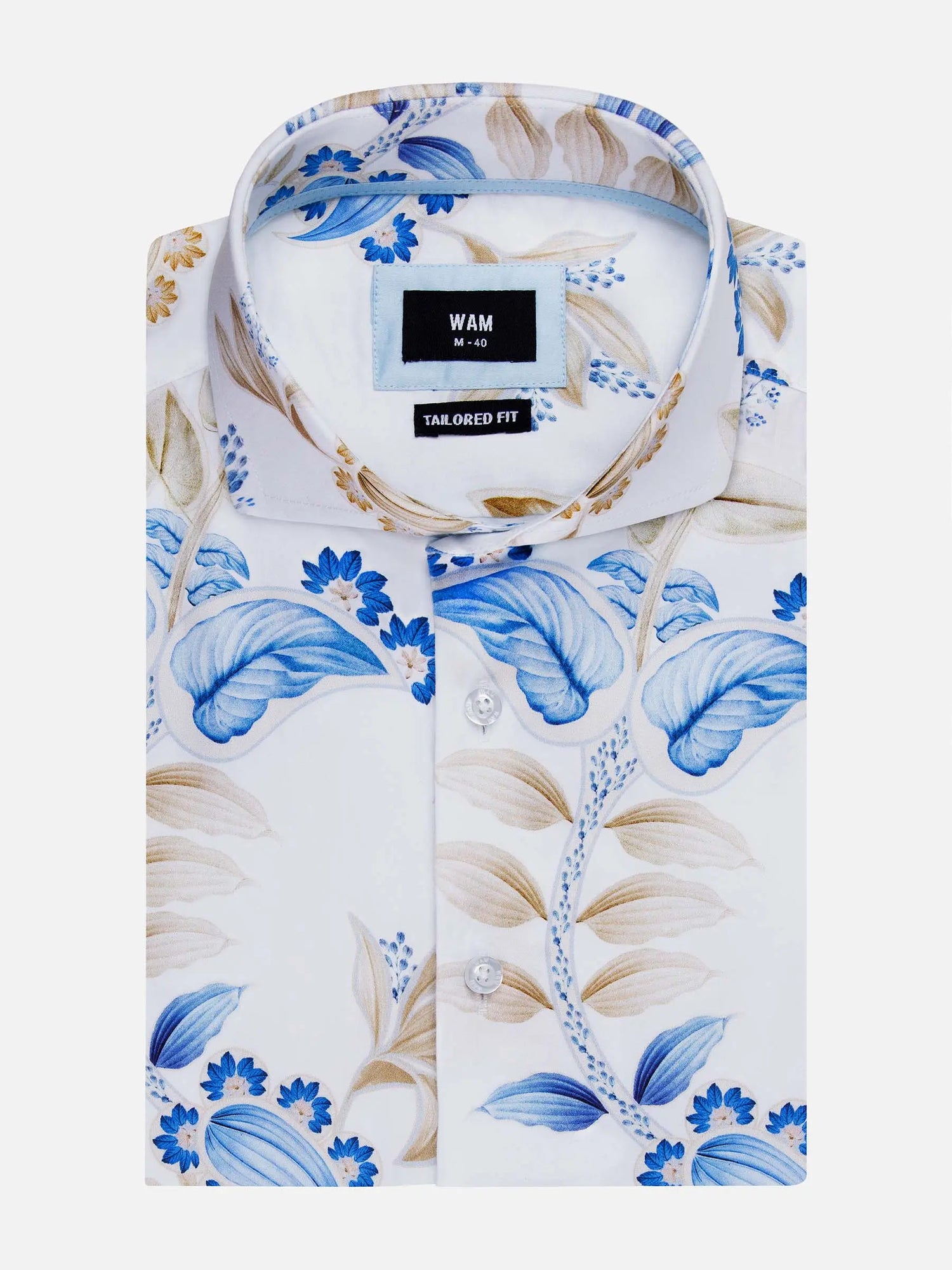 Folded white floral shirt with blue and beige leaf pattern, tailored fit label visible – Wam Denim.