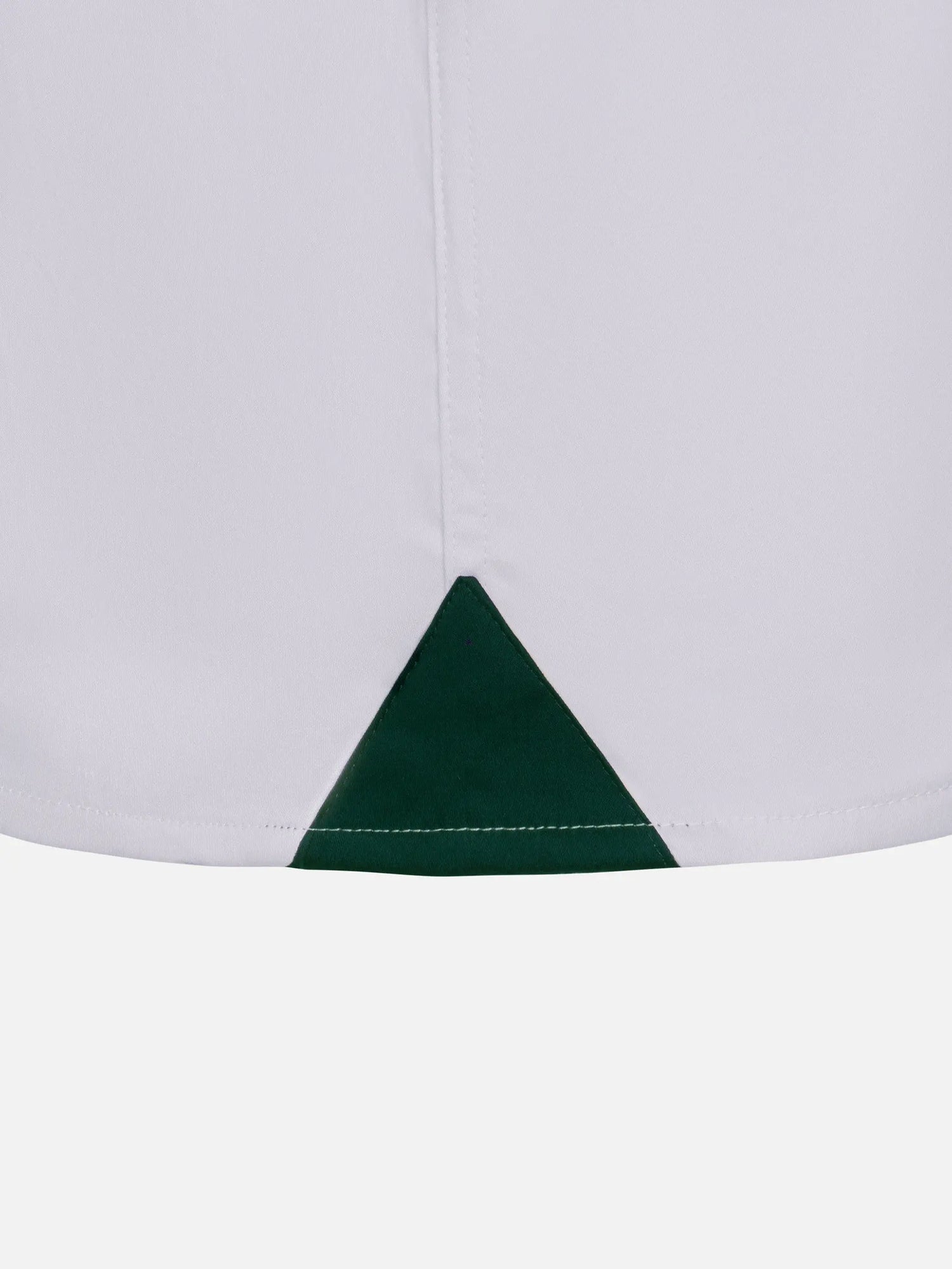 Close-up of the hem split on a white men's dress shirt – Wam Denim.