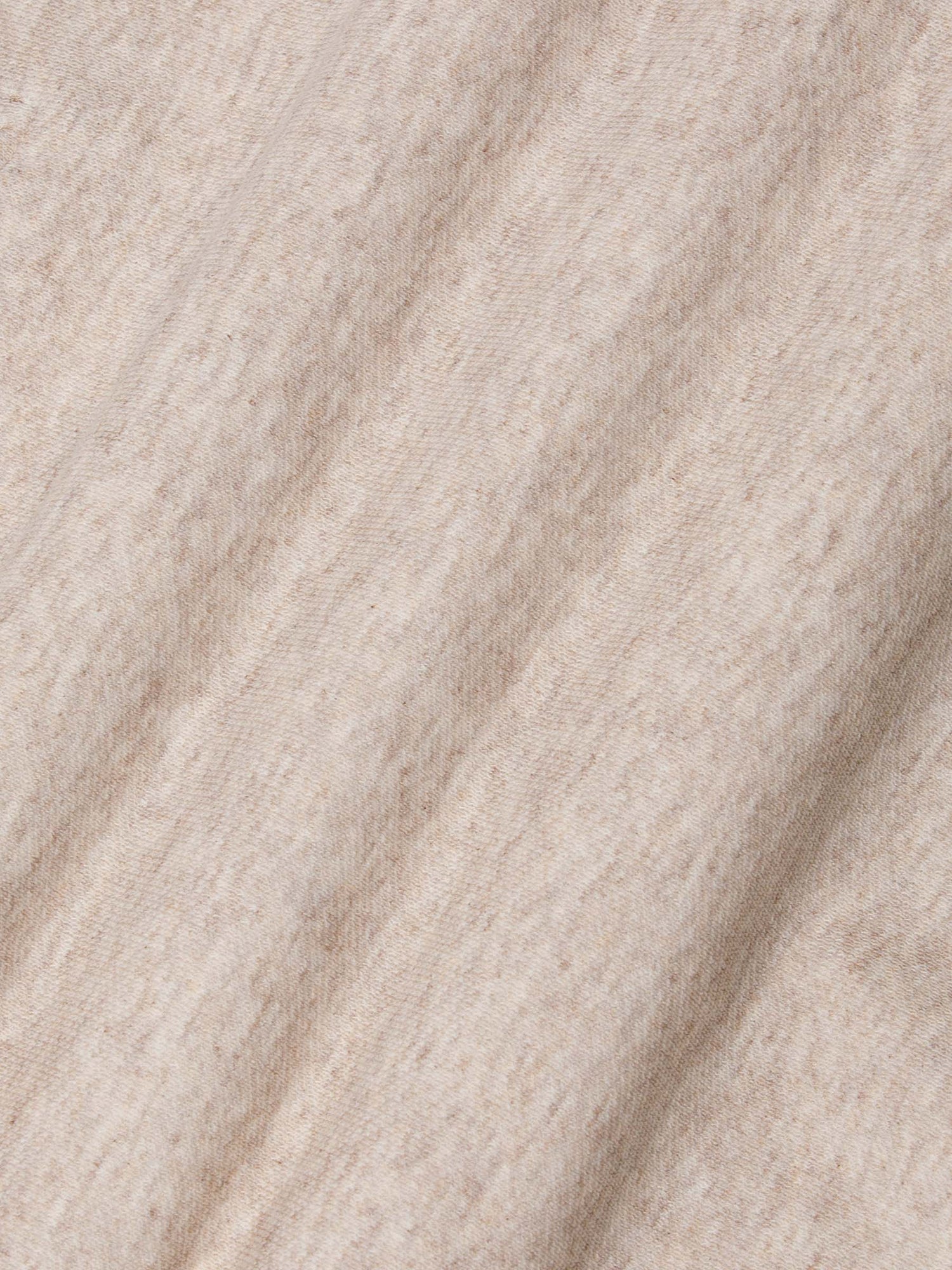Close-up of beige fabric with a textured pattern