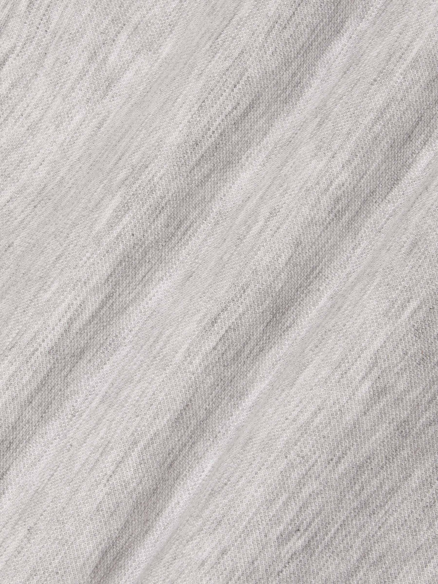 Close-up of soft light grey sweatshirt fabric showing smooth knit texture – Wam Denim.