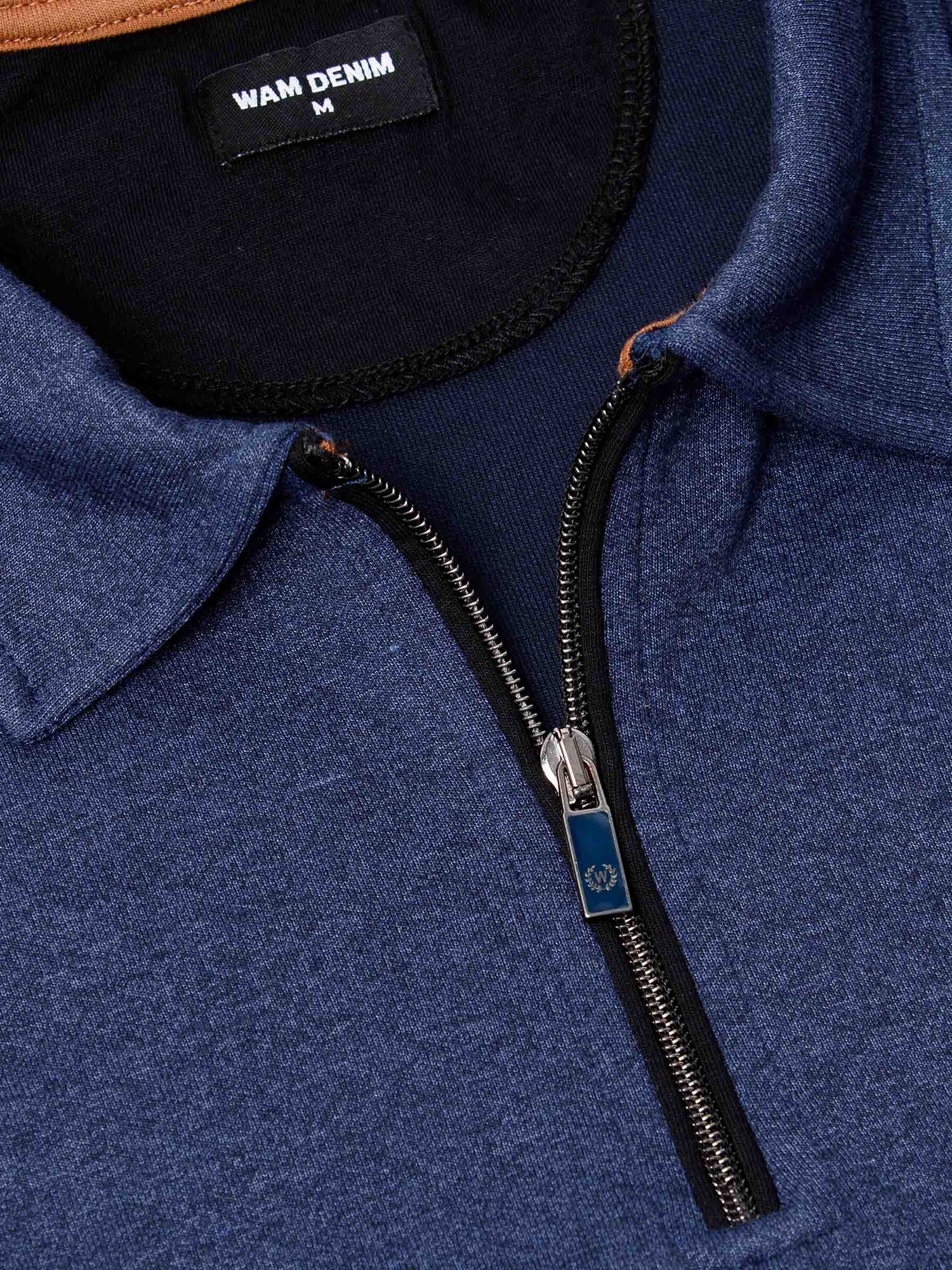 Close-up of light indigo quarter-zip collar and zipper detail with Wam Denim label – Wam Denim.