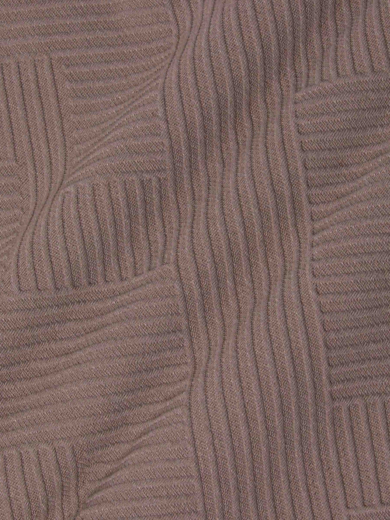 Close-up texture of knit fabric with geometric pattern – Wam Denim.