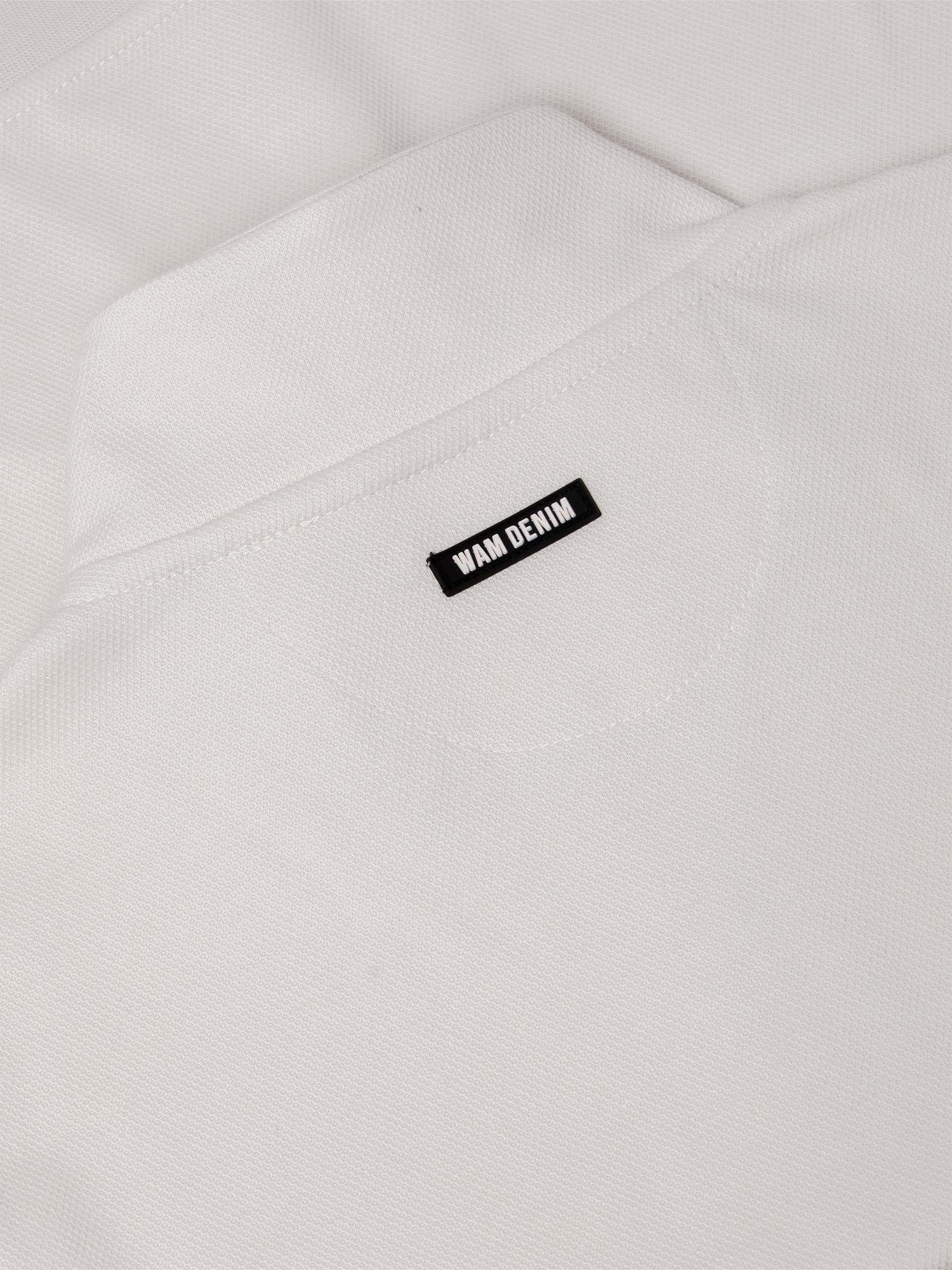 Close-up of light beige Milburn Sweater fabric texture. – Wam Denim.