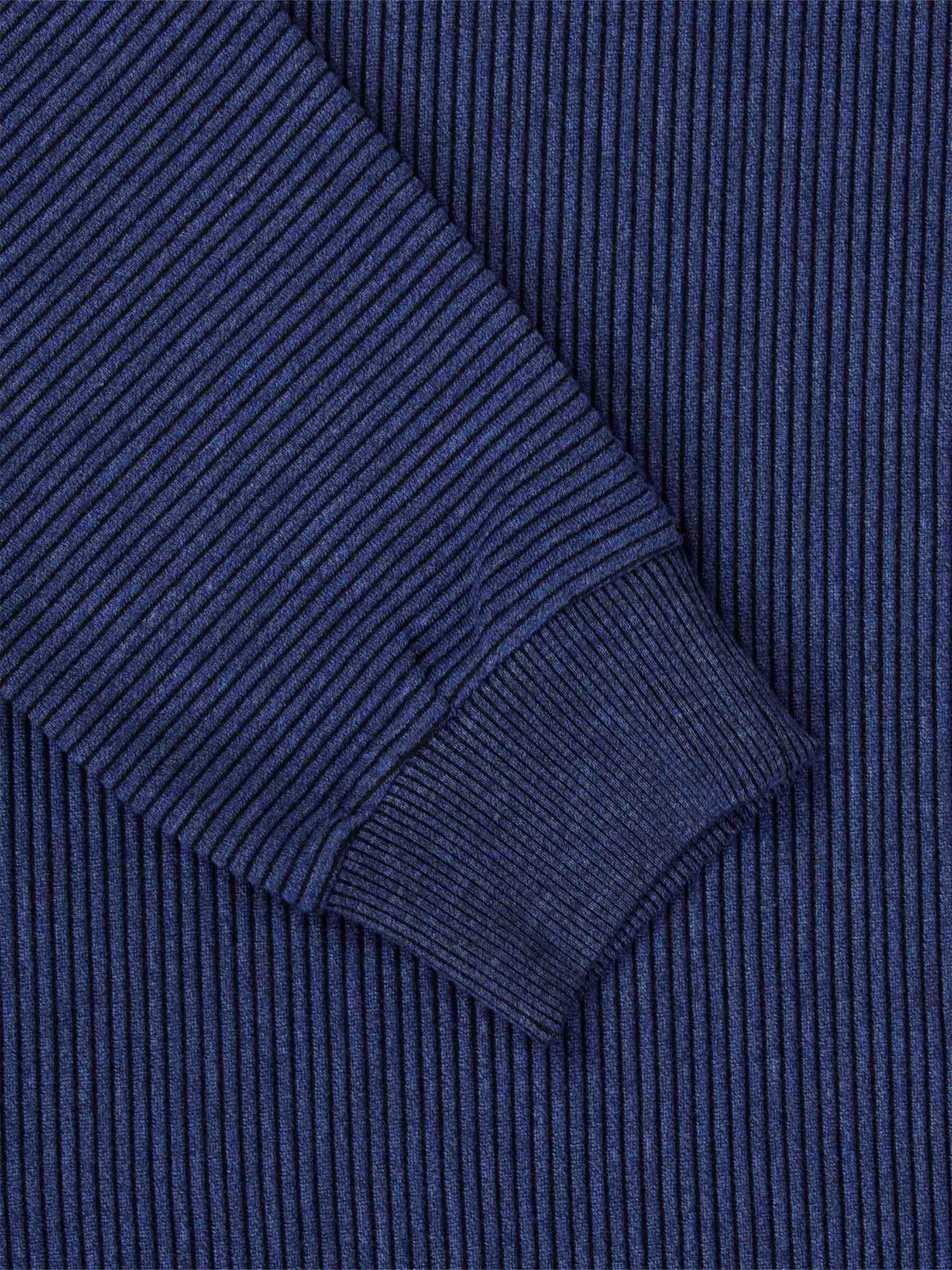 Close-up of the ribbed cuff and navy stripe knit on the sweater – Wam Denim.