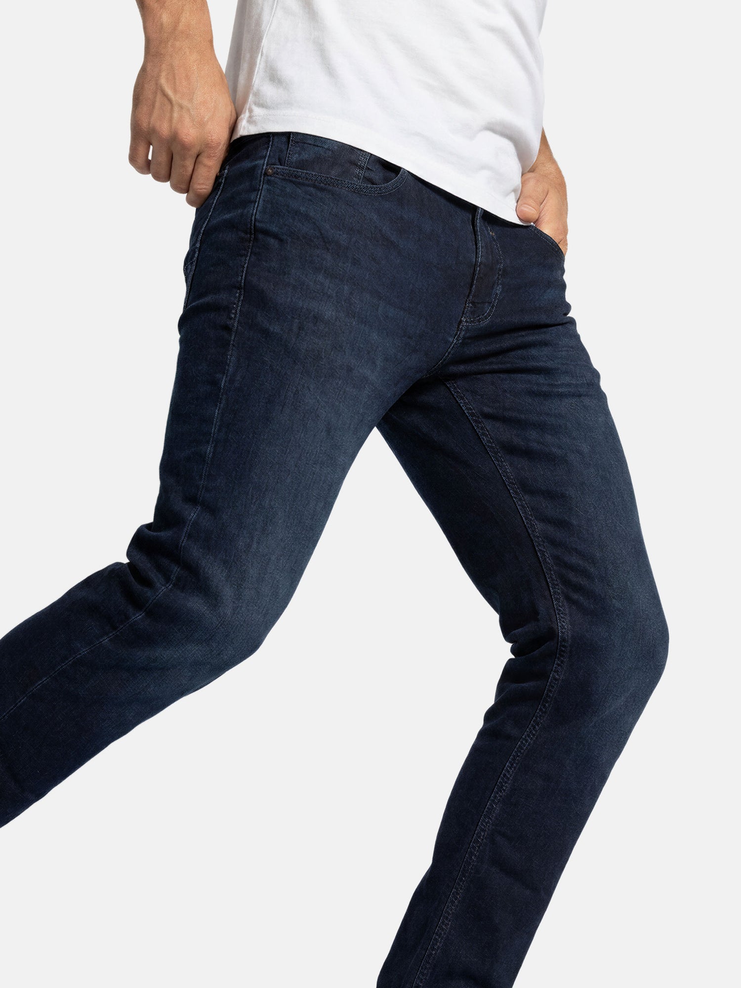 Side view of navy men’s slim fit jeans highlighting stretch denim and modern silhouette.