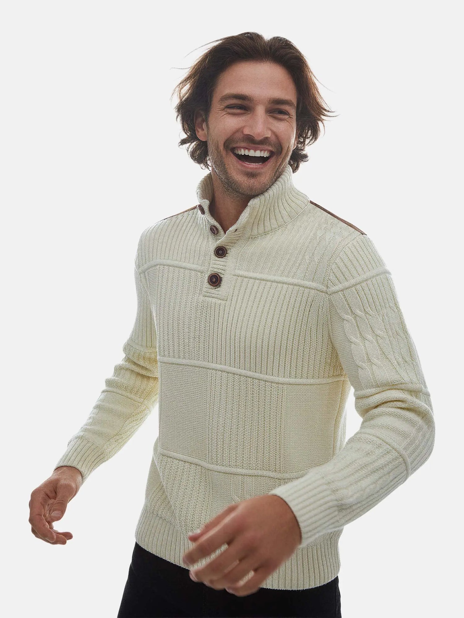 Close-up view of a man wearing an off-white textured knit sweater with button-neck design.