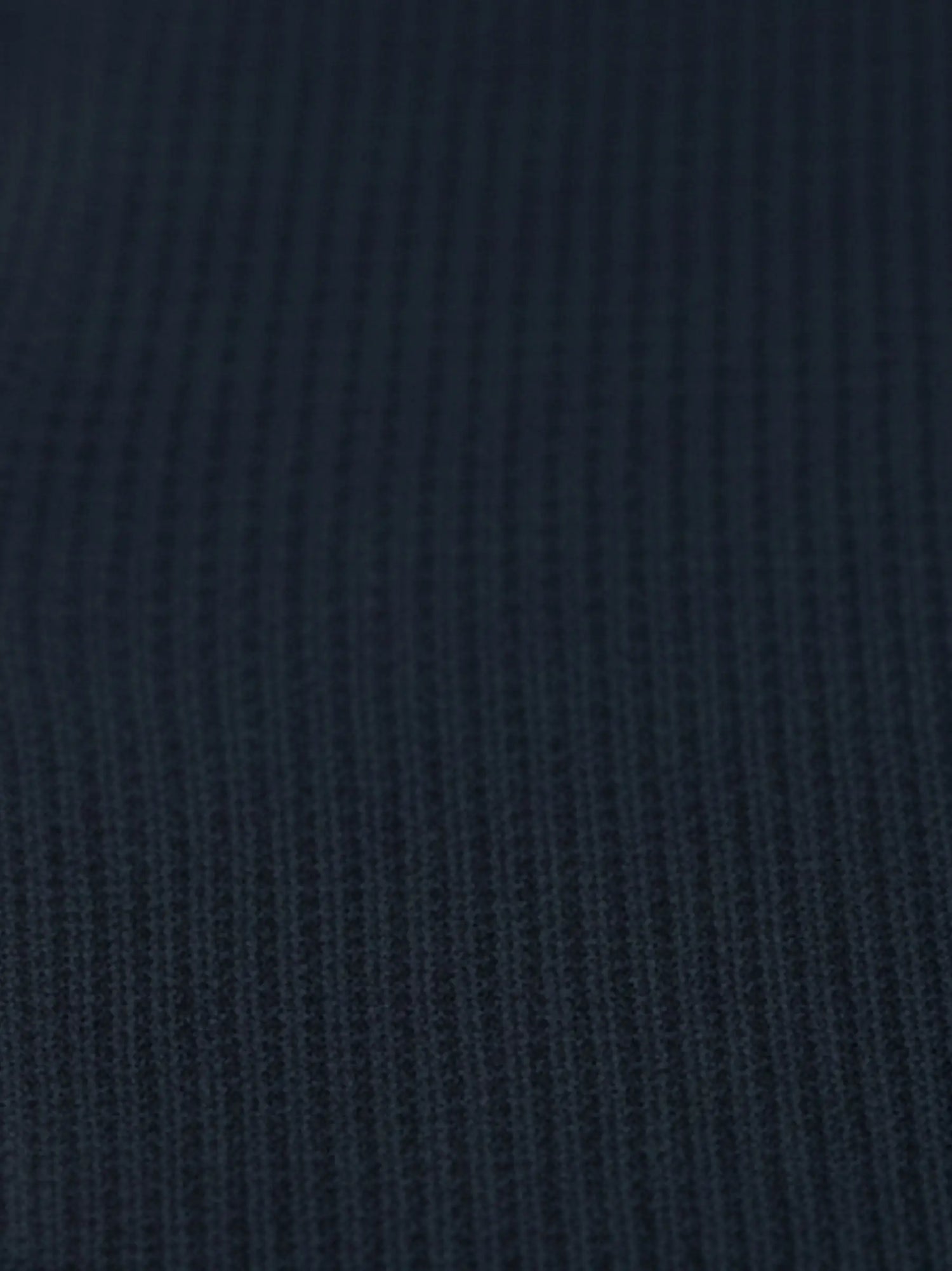 Close-up of navy textured knit fabric from the Zest Navy sweater.