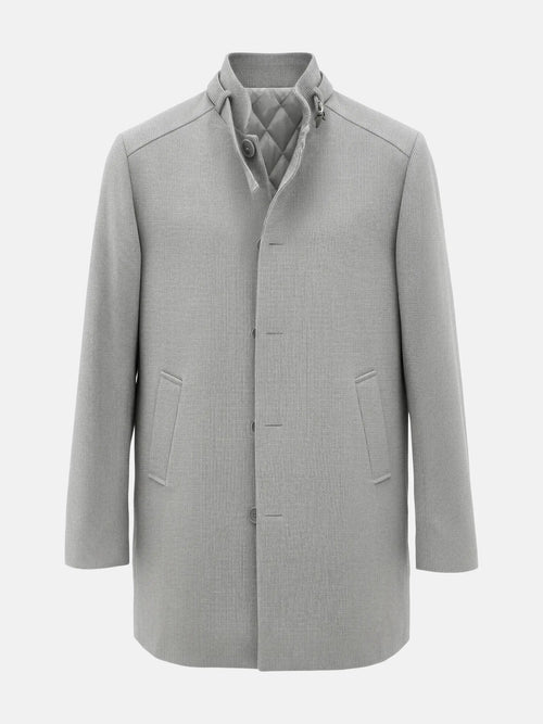 Light grey men’s trenchcoat with quilted inner lining and clean, minimalist front design.