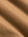 Close-up of soft camel brown fabric showing smooth texture and fine weave – Wam Denim.