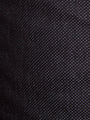 Close-up of black textured denim fabric with fine dotted weave pattern – Wam Denim.