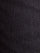 Close-up of black textured denim fabric with fine dotted weave pattern – Wam Denim.