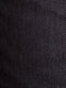 Close-up of black textured denim fabric with fine dotted weave pattern – Wam Denim.