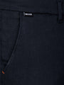 Front pocket detail of navy textured chinos with Wam Classic label – Wam Denim.