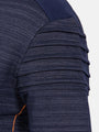 Close-up of a textured navy fabric with pleated detailing on a white background