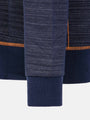 Close-up of a navy fabric with orange trim on a white background