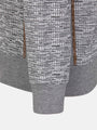 Close-up of the ribbed cuff and textured grey knit on the sweater – Wam Denim.