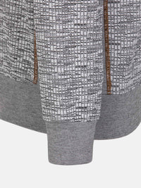 Close-up of the ribbed cuff and textured grey knit on the sweater – Wam Denim.