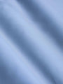 Close-up of smooth light blue fabric showing soft texture and fine weave – Wam Denim.