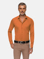 Model wearing slim-fit orange long sleeve dress shirt styled with beige pants – Wam Denim.