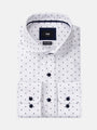 Folded white shirt with navy mini-dot pattern and dark buttons, non-iron fabric – Wam Denim.