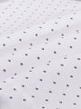Close-up of white shirt fabric with navy and brown mini-dot pattern in herringbone texture – Wam Denim.