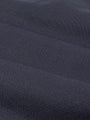 Close-up of dark blue denim fabric with textured weave. – Wam Denim.