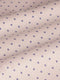 Close-up of beige fabric with purple dot pattern, textured. – Wam Denim.