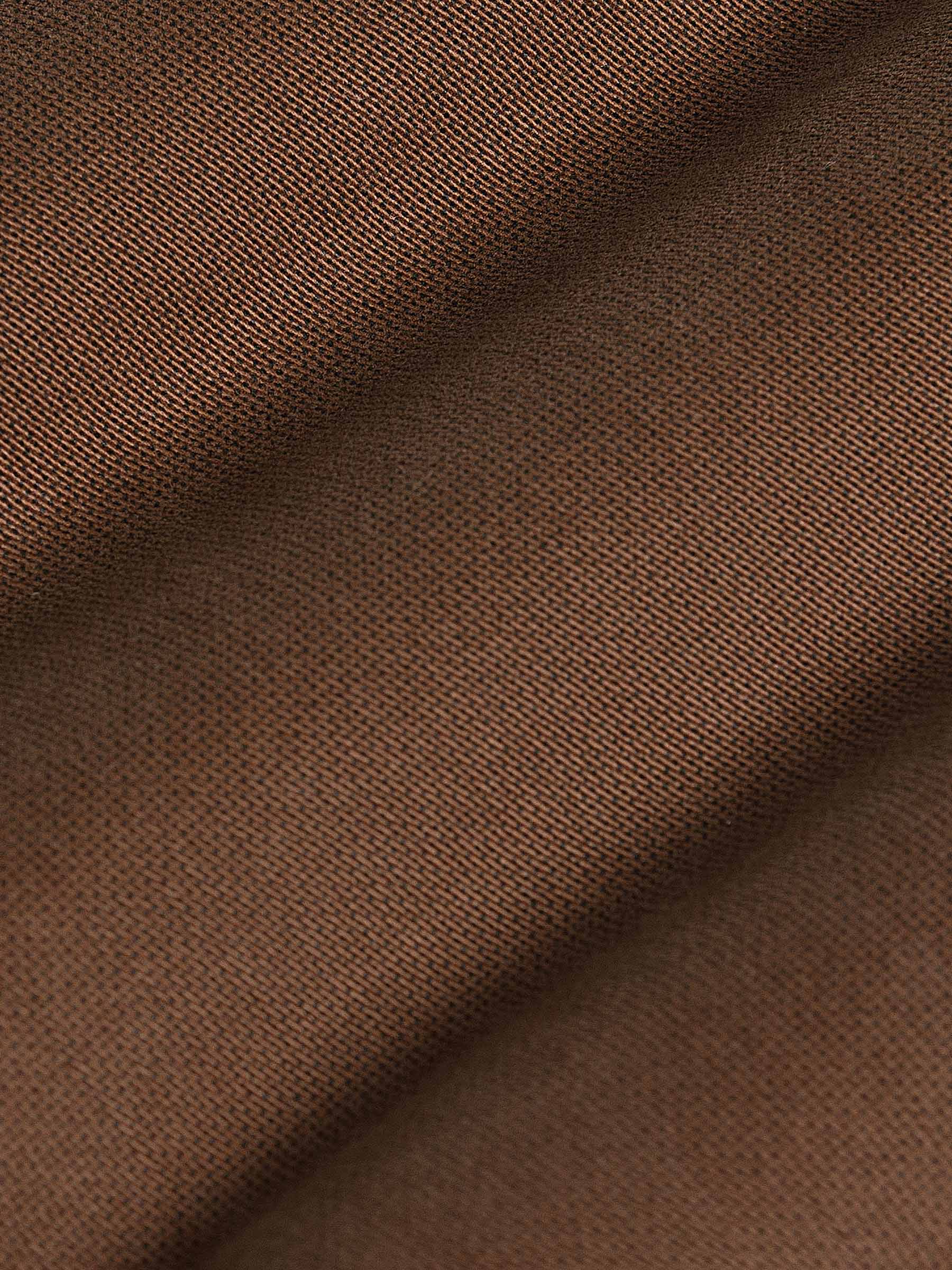 Close-up of brown jeans zipper with durable denim finish. – Wam Denim.