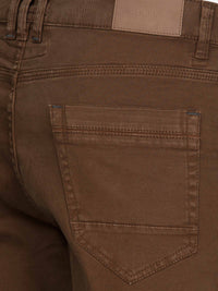 Close-up of black jeans with stylish pocket design. – Wam Denim.