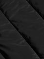 
Close-up texture of the black puffer jacket's quilted nylon fabric – Wam Denim.