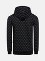 Back view of black patterned hoodie with geometric print and ribbed hem – Wam Denim.