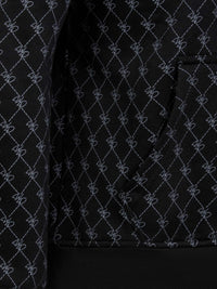 Close-up of black patterned hoodie pocket with stitched geometric design and ribbed hem – Wam Denim.