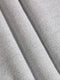 Close-up of textured gray fabric with folds