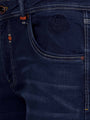 Close-up of dark navy denim jeans front pocket with embossed Wam Denim logo and stitching – Wam Denim.