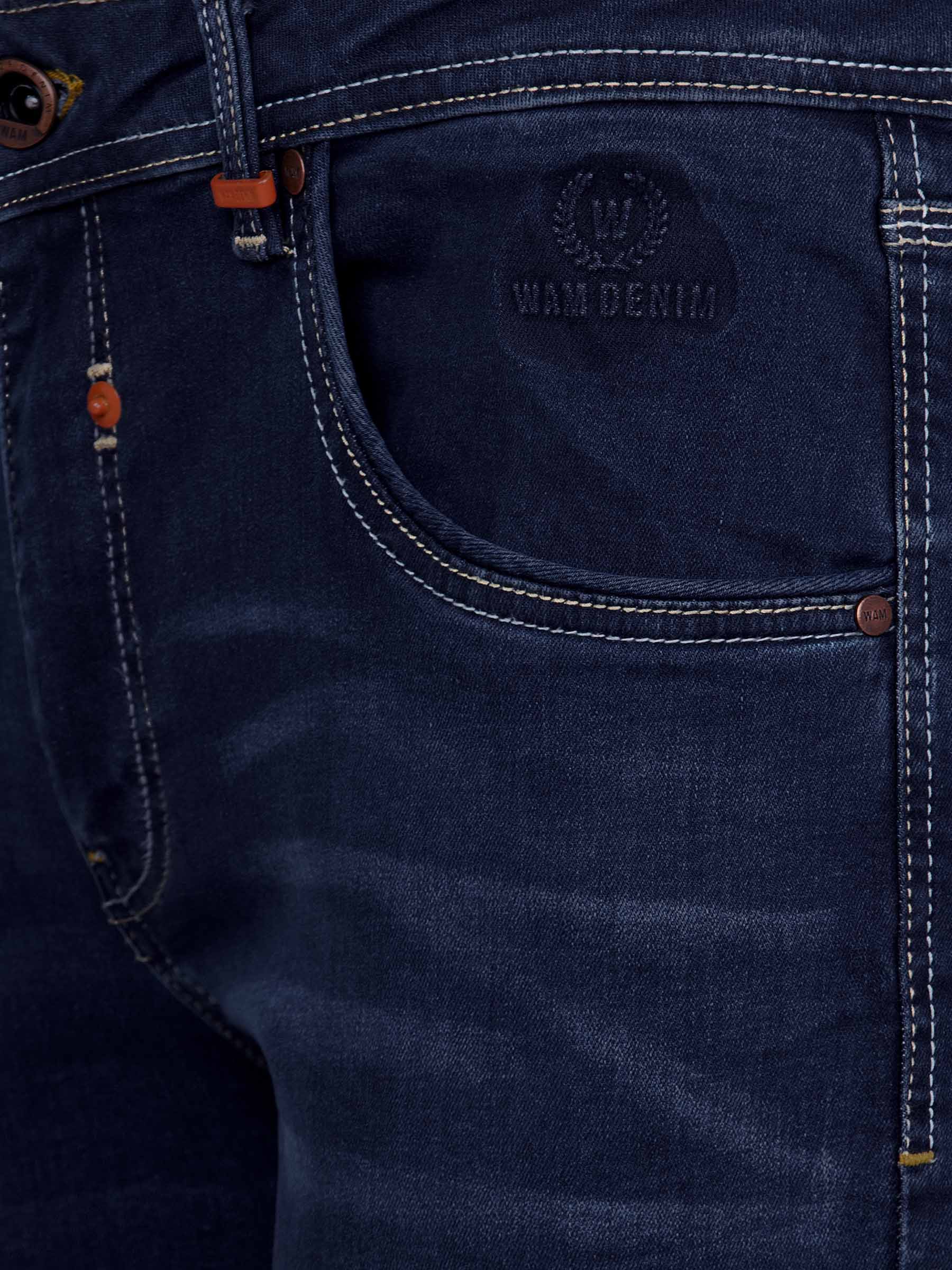 Close-up of dark navy denim jeans front pocket with embossed Wam Denim logo and stitching – Wam Denim.