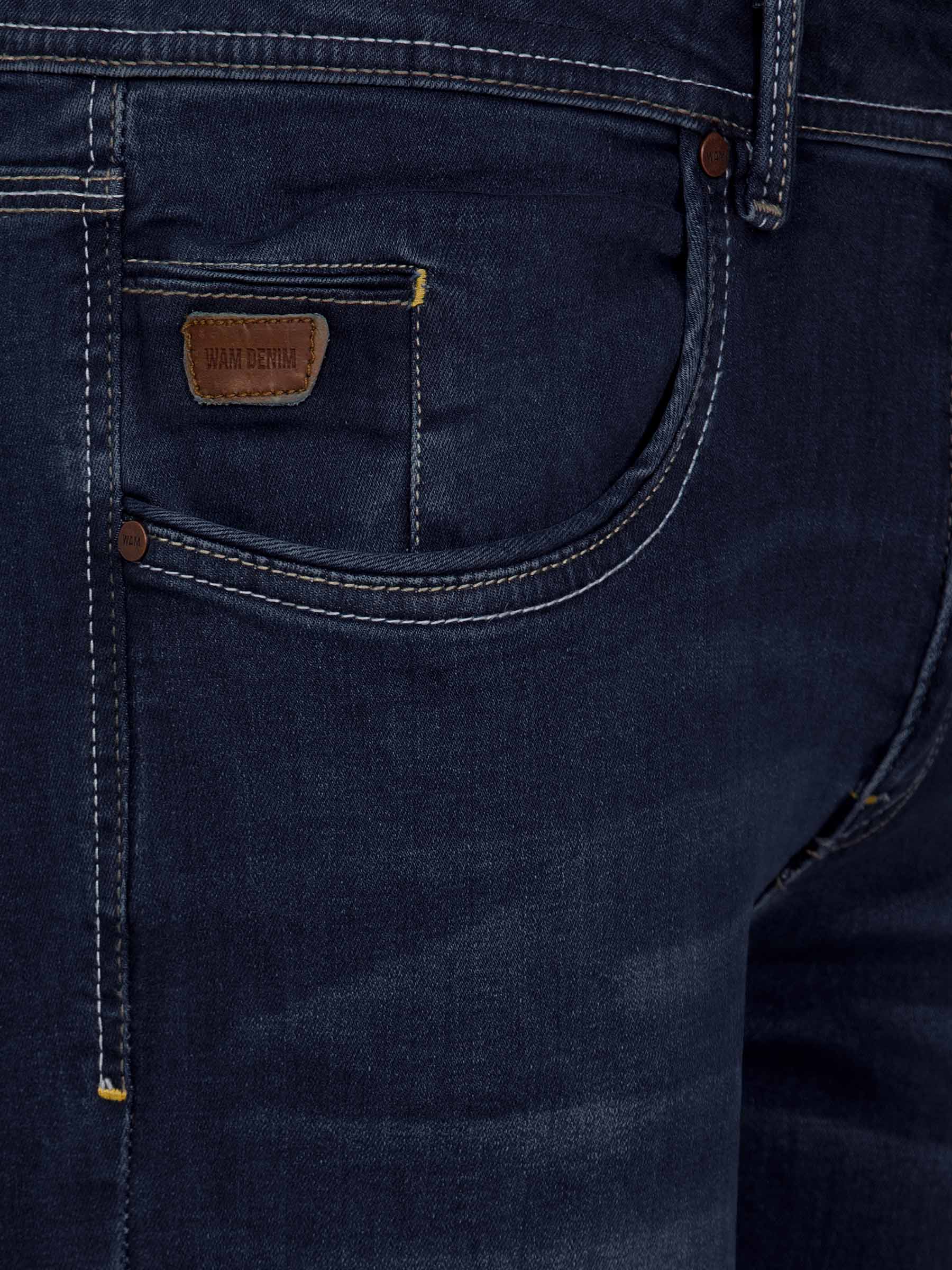 Front pocket close-up of dark navy jeans with leather Wam Denim label and contrast stitching – Wam Denim.