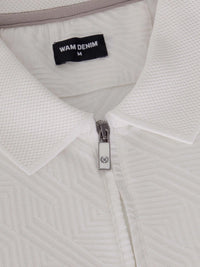 Close-up of the zipper and collar on the white zip polo shirt – Wam Denim.