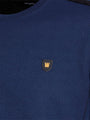 Close-up of navy Moorland Sweater with logo detail. – Wam Denim.