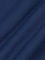 Close-up of textured navy Moorland Sweater fabric. – Wam Denim.