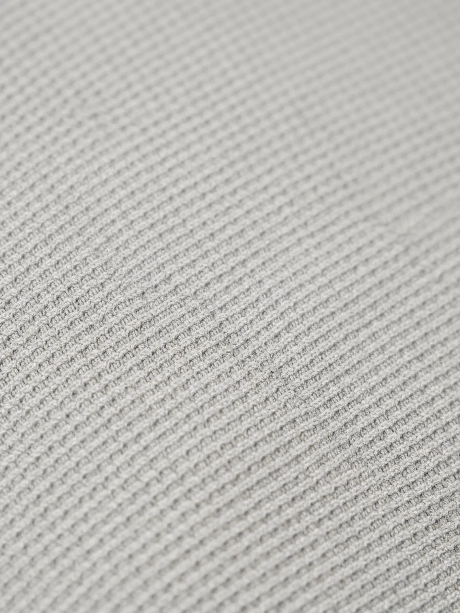 Close-up of light grey pantalon fabric showing fine textured weave pattern.