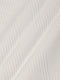 Close-up of white sweatshirt fabric featuring soft geometric textured pattern – Wam Denim.