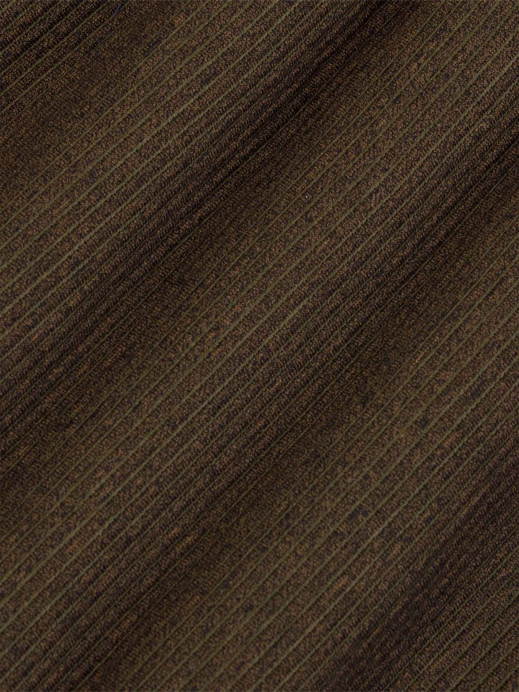 Close-up texture of diagonally ribbed knit fabric – Wam Denim.